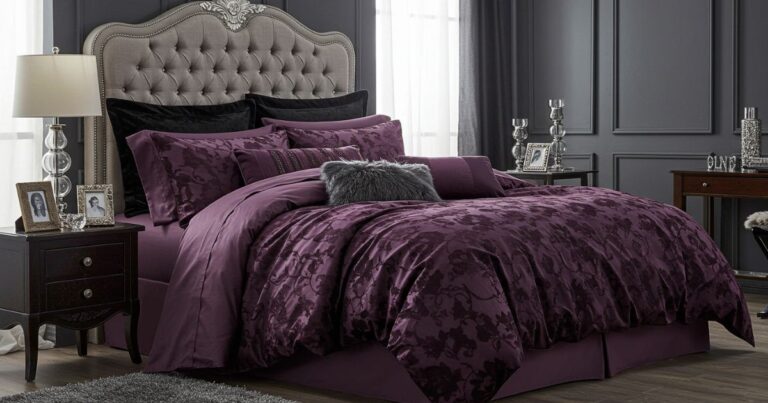 Chic Bedroom with Bold Black and Purple Color Scheme and Metallic Accents